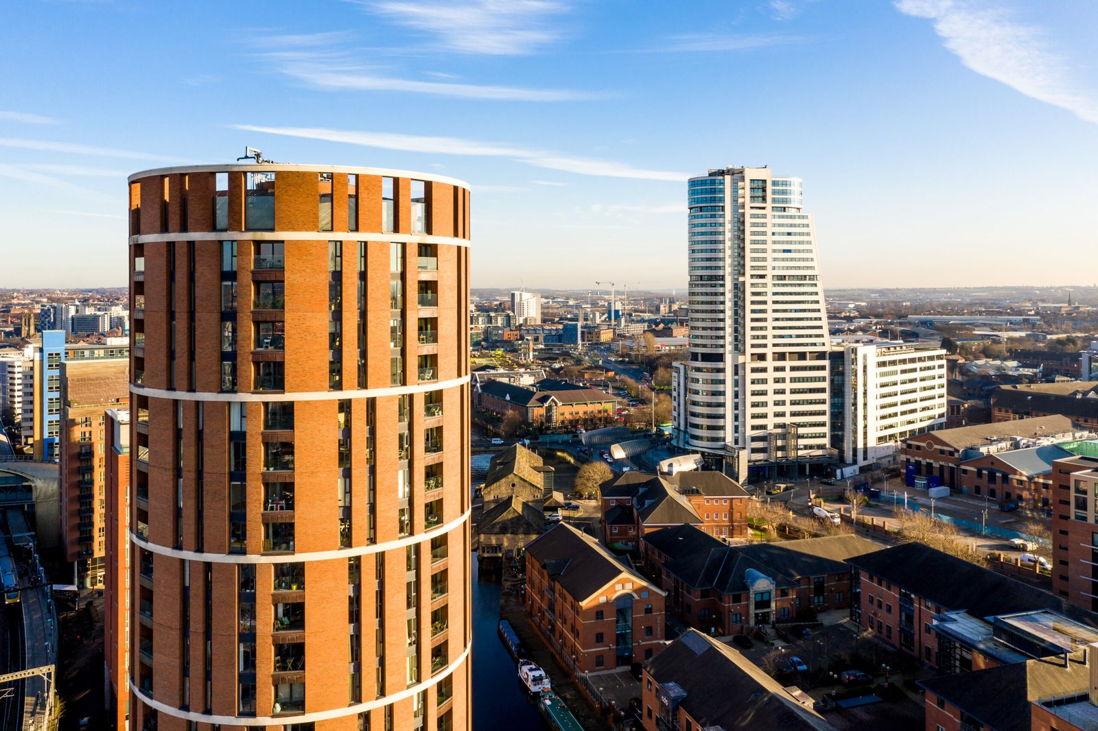 Aerial view of Leeds city skyline representing mixed-use urban elevator environments