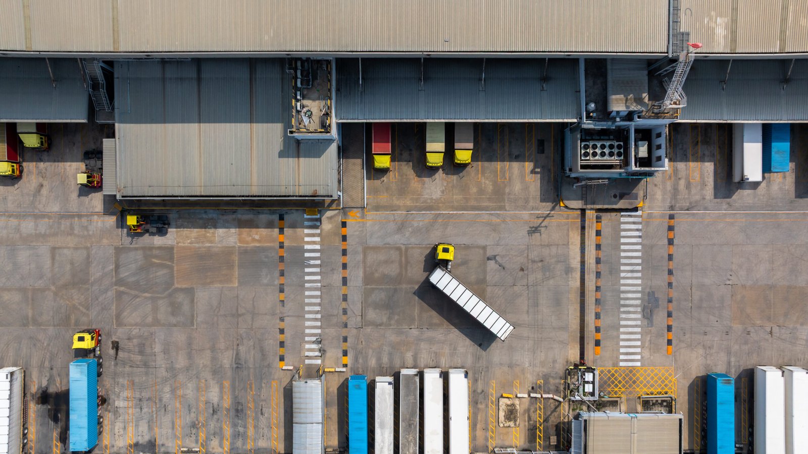 Export truck and cargo trailer at a logistics yard