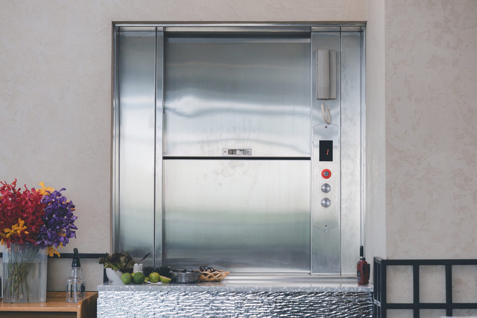 Dumbwaiter lift in a restaurant kitchen representing industrial and logistics service elevators