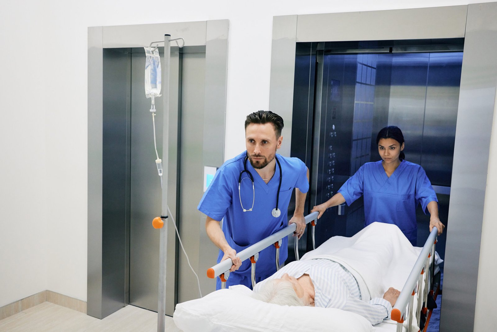 Hospital staff transporting a patient